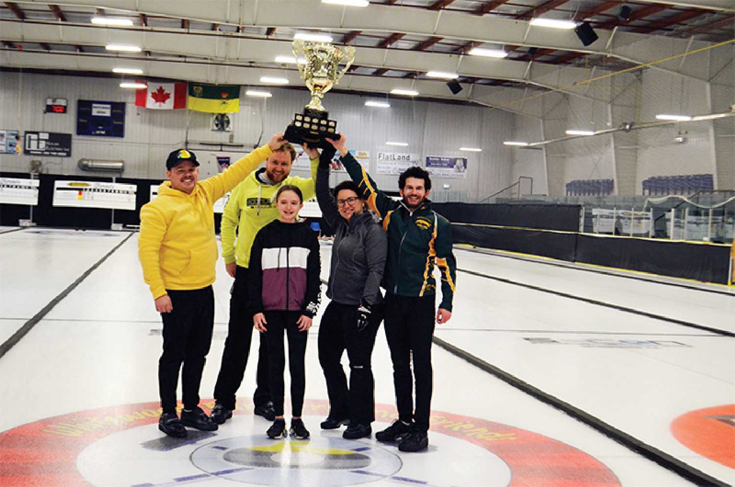 The winning team at the 2023 Whitewood Farmers and Friends Bonspiel was the Regina Highland Curling Club team. From left, Ben Gamble (skip), Rory McCusker (third), Jade Bloor (second) and Giovanni Wright (lead). Kelbree Page, centre, presented the Doris & Bert Page Memorial Trophy to the winning team following the final game on March 27 in the Whitewood Community Centre.